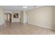 A large living room with tile floors, archways, and great natural light at 326 Cotswold Cir, Davenport, FL 33837