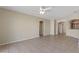 Open concept living room with tile flooring, neutral colors, and multiple archways at 326 Cotswold Cir, Davenport, FL 33837