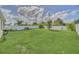 Expansive backyard with a lush lawn, offering a private outdoor space and white perimeter fence at 3308 Country Walk Club Cir, Winter Haven, FL 33881