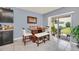 Cozy dining area featuring a stylish table with seating and sliding glass doors to the backyard at 3308 Country Walk Club Cir, Winter Haven, FL 33881