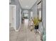 Inviting home entryway featuring tile flooring, a high ceiling, neutral paint, and decorative accents at 3308 Country Walk Club Cir, Winter Haven, FL 33881