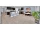 Open concept kitchen featuring granite countertops, stainless steel appliances, and a breakfast bar at 3308 Country Walk Club Cir, Winter Haven, FL 33881