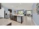 Bright kitchen with stainless steel appliances, granite countertops, large island and an open floor plan at 3308 Country Walk Club Cir, Winter Haven, FL 33881