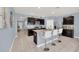 Open-concept kitchen featuring granite countertops, stainless steel appliances, and a large island with seating at 3308 Country Walk Club Cir, Winter Haven, FL 33881
