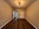 An open bedroom showcases new floors, and a view of the closet and bathroom doors at 3332 Robert Trent Jones Dr # 10703, Orlando, FL 32835