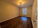 Bedroom with hardwood floors, bright window and neutral wall color at 3332 Robert Trent Jones Dr # 10703, Orlando, FL 32835