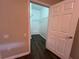 Spacious walk-in closet features hardwood floors and ample shelving for optimal storage solutions at 3332 Robert Trent Jones Dr # 10703, Orlando, FL 32835