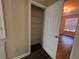 Hall closet with a wire shelving system and dark floors at 3332 Robert Trent Jones Dr # 10703, Orlando, FL 32835