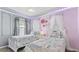 Charming princess-themed ' bedroom with whimsical decor, soft lighting, and delightful details at 3356 Lilac Way, Davenport, FL 33897