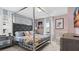 Beautifully decorated bedroom with a canopy bed, chic furnishings, and soft lighting at 3356 Lilac Way, Davenport, FL 33897