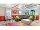 Fun themed bedroom with colorful decor, a playful mural, and a comfortable seating area at 3356 Lilac Way, Davenport, FL 33897