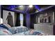 Star Wars themed bedroom with two beds, murals and themed lighting at 3356 Lilac Way, Davenport, FL 33897
