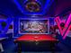 Avengers themed entertainment room with pool table, Avengers mural and bright lighting at 3356 Lilac Way, Davenport, FL 33897