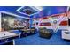 Avengers-themed game room featuring a pool table, air hockey, arcade game, and themed decor at 3356 Lilac Way, Davenport, FL 33897