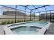 Screened in pool and spa area with views of neighboring backyards at 3356 Lilac Way, Davenport, FL 33897