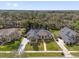 Expansive aerial view showcasing the home, lush landscaping, and surrounding neighborhood at 358 Woldunn Cir, Lake Mary, FL 32746
