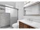 Bathroom features a vanity with drawers, a framed mirror and a tiled shower with sliding glass doors, plus a toilet at 358 Woldunn Cir, Lake Mary, FL 32746