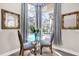 Charming breakfast nook with a glass table and views of the backyard pool at 358 Woldunn Cir, Lake Mary, FL 32746
