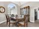 Formal dining room featuring classic furniture, elegant lighting, and a large window at 358 Woldunn Cir, Lake Mary, FL 32746