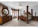 Elegant main bedroom with a four-poster bed, chandelier, and decorative accents at 358 Woldunn Cir, Lake Mary, FL 32746