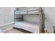 Bedroom featuring bunkbeds, with shutter blinds and a nautical theme at 3801 S Atlantic Ave # 105, New Smyrna Beach, FL 32169