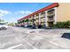 Exterior view of condo building, parking, balconies, and well-maintained surroundings at 3801 S Atlantic Ave # 105, New Smyrna Beach, FL 32169