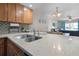 The bright and airy kitchen leads to a cozy living area with comfortable seating and ample natural light at 3801 S Atlantic Ave # 105, New Smyrna Beach, FL 32169