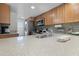 Bright kitchen showcasing granite countertops, stainless steel appliances, and stylish backsplash at 3801 S Atlantic Ave # 105, New Smyrna Beach, FL 32169