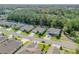 Beautiful aerial view of homes nestled among mature trees, with a community that offers a serene and natural setting at 388 Nowell Loop, Deland, FL 32724