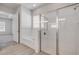 This bathroom features a bathtub, a shower with glass door, and wood look tile at 388 Nowell Loop, Deland, FL 32724