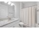 Bathroom with single sink, granite countertop, large mirror, and a shower-tub combination at 388 Nowell Loop, Deland, FL 32724