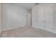 Bright bedroom featuring neutral walls and carpet with two five panel doors at 388 Nowell Loop, Deland, FL 32724