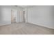 Spacious bedroom with neutral carpet and light walls leading to a walk-in closet and bathroom at 388 Nowell Loop, Deland, FL 32724