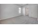 Carpeted bedroom featuring a window and access to the ensuite bathroom at 388 Nowell Loop, Deland, FL 32724