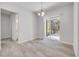 Dining area featuring tile floors and access to the screened patio and backyard at 388 Nowell Loop, Deland, FL 32724