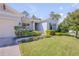 Charming single-story home with a lush green lawn and well-manicured landscaping, showcasing curb appeal at 388 Nowell Loop, Deland, FL 32724
