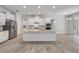 Charming kitchen features white cabinets, stainless steel appliances, stone countertops, and tile flooring at 388 Nowell Loop, Deland, FL 32724