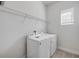 A laundry room features a full washer and dryer set along with a wire shelf at 388 Nowell Loop, Deland, FL 32724