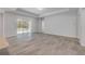 Open living room with tile floors and sliding glass doors leading to the outdoor pool area at 388 Nowell Loop, Deland, FL 32724