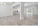 Open concept home boasts tile flooring, sliding glass doors leading to the patio, and neutral paint at 388 Nowell Loop, Deland, FL 32724