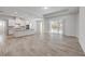 Open floor plan with kitchen and living room, tile floors, and a view of the pool area at 388 Nowell Loop, Deland, FL 32724