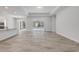 Open floor plan living area with tile floors and view to outdoor lanai at 388 Nowell Loop, Deland, FL 32724