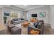 Comfortable living room featuring stylish furniture, large windows, and plenty of natural light at 388 Nowell Loop, Deland, FL 32724