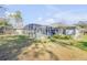 This home features a screened-in pool, perfect for enjoying the outdoors while staying cool and protected from the elements at 388 Nowell Loop, Deland, FL 32724