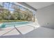 Relaxing backyard pool with a screened enclosure, perfect for enjoying outdoor living at 388 Nowell Loop, Deland, FL 32724