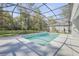 Backyard pool with screened enclosure, ideal for cooling off and relaxing in privacy at 388 Nowell Loop, Deland, FL 32724