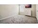 Bedroom with carpet, mounted TV, dresser, and a window for natural light at 3908 Grassland Dr, Orlando, FL 32824