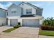 Charming two-story townhome with a two-car garage and a well-maintained lawn at 3908 Grassland Dr, Orlando, FL 32824