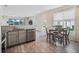 Modern kitchen with stainless appliances and an adjacent eat-in dining area at 3908 Grassland Dr, Orlando, FL 32824