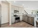 Well-equipped kitchen featuring stainless appliances, gray cabinets, and stylish backsplash at 3908 Grassland Dr, Orlando, FL 32824